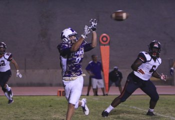 Receiver Jack Foote brings in a touchdown pass Friday night against Memorial High School. 